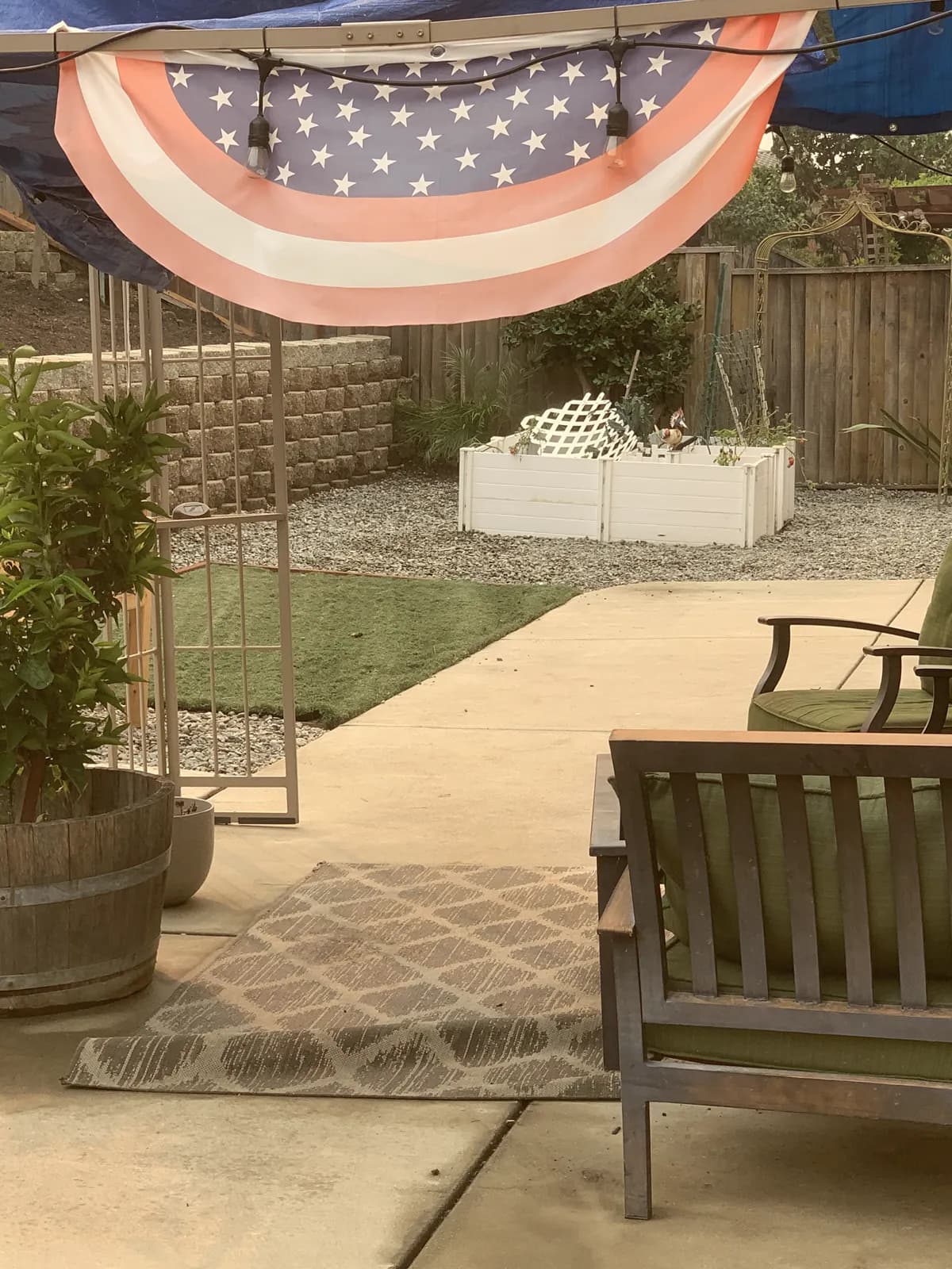 Finished concrete patio with garden seating under patriotic bunting