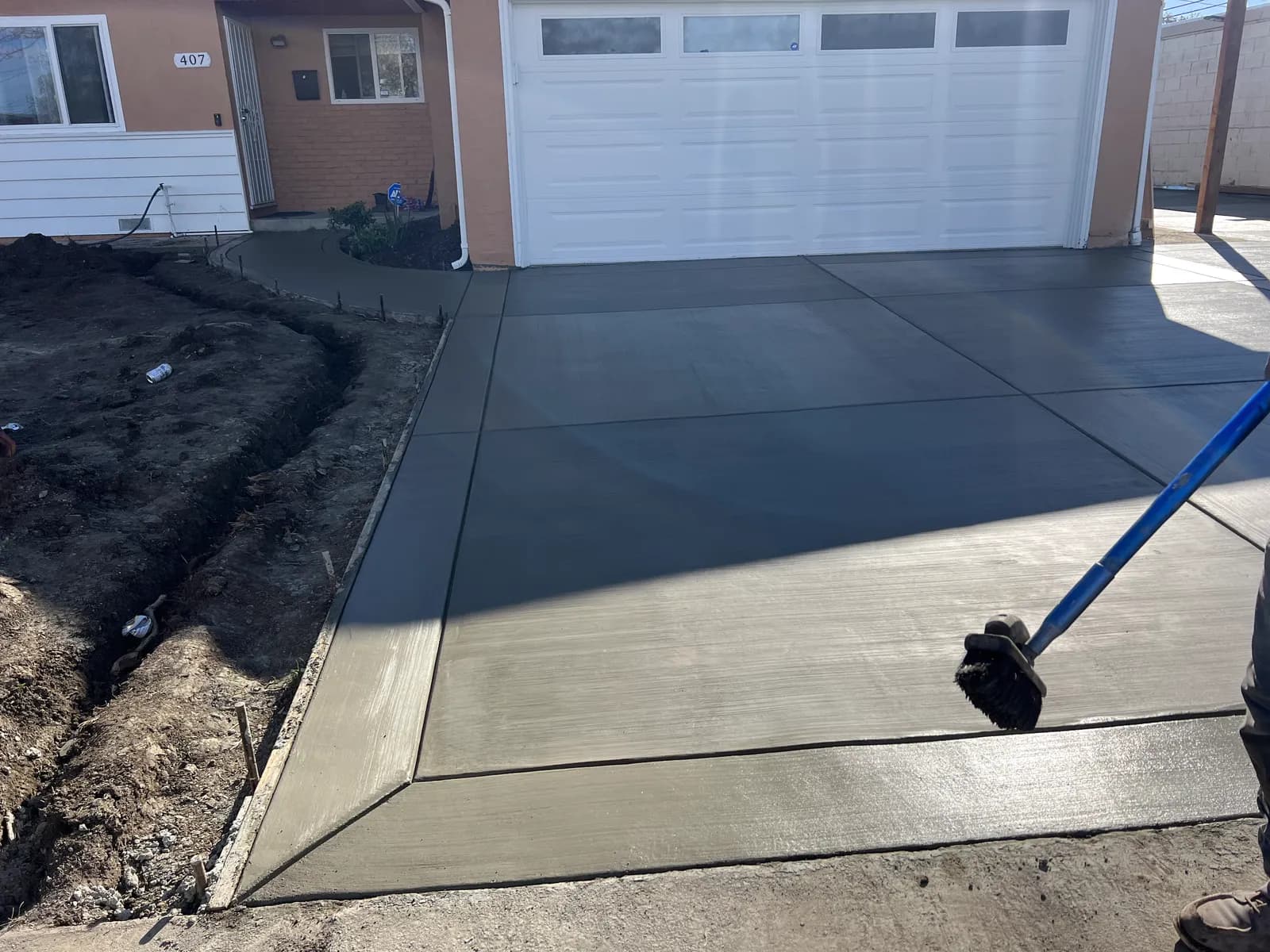 Finished concrete driveway with a contrasting dark border