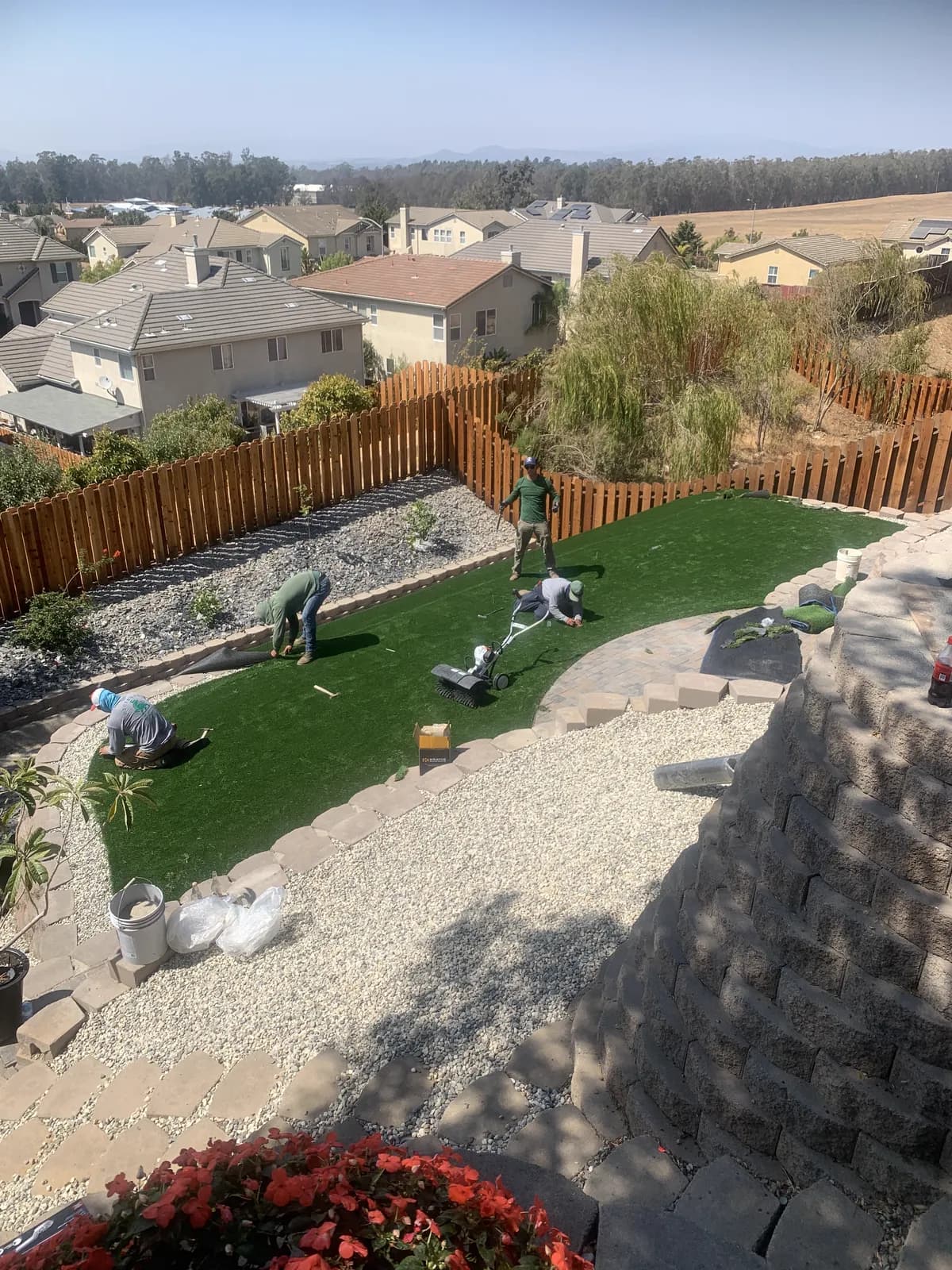 Completed hillside putting green with block retaining walls